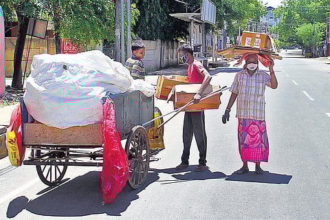 Day labourer Sudalaimani and family, who cannot find work amidst the lockdown, now eke out a living collecting and selling scrap. (Photo | Express)