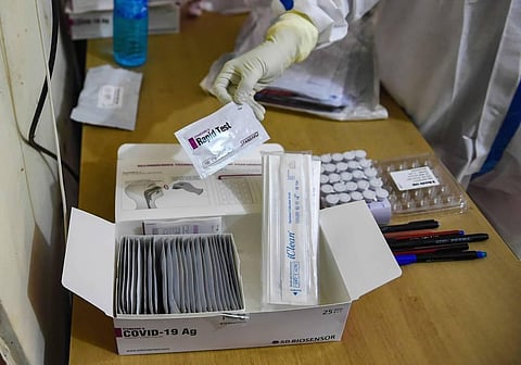 A health worker shows a rapid antigen testing kit during a COVID-19 medical check-up of residents of Kurar Village as coronavirus cases surge across the state in Mumbai Monday July 13 2020. (Photo | PTI)