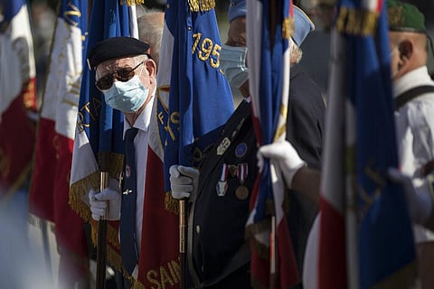 A veteran wears a face mask prior to a Bastille Day ceremony in Marseille,