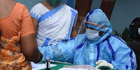 A woman registring her name to get COVID-19 tested at Urban Primary Health Centre in Hyderabad on Monday.(Photo | RVK Rao, EPS)