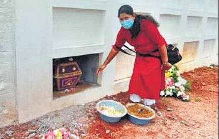A woman visits the vault at St Francis Xavier Church where her family member has been interred, in Mangaluru | Express
