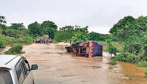 An overflowing stream cuts off road connectivity between villages at Tiruvuru mandal in Krishna district on Tuesday. (Photo| EPS)