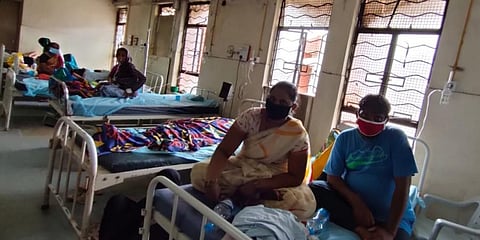 Patients can be seen sitting beside body of a suspected COVID-19 victim at OGH (Photo | EPS)