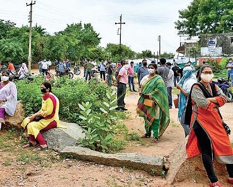 Parents outside St Andrews School at Bowenpally in Secunderabad on Tuesday | S SENBAGAPANDIYAN