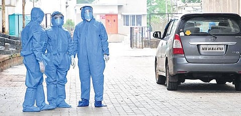 Doctors in PPEs outside a private hospital in Belagavi district | Ashishkrishna HP