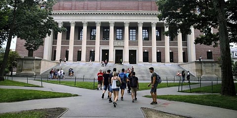 Students walk near the Widener Library in Harvard Yard at Harvard University in Cambridge. (Photo | AP)