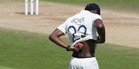England's Jofra Archer rubs the ball on his back during Day 5 of the 1st Test match with West Indies, at the Ageas Bowl in Southampton. (Photo| AP)