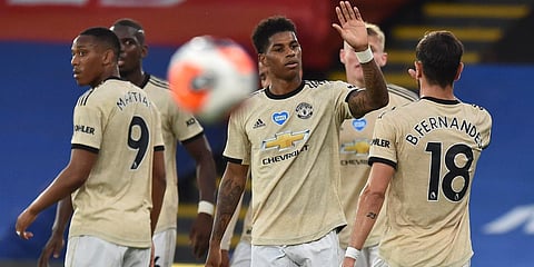 Manchester United's Marcus Rashford (C) celebrates after scoring the opening goal during the EPL match with Crystal Palace at Selhurst Park in London. (Photo| AP)
