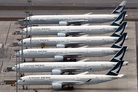 In this March 6, 2020, file photo, Cathay Pacific Airways aircraft line up on the tarmac at the Hong Kong International Airport. (File Photo | AP)