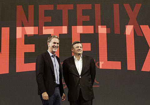 Netflix CEO Reed Hastings, left, poses with Ted Sarandos, chief content officer of Netflix, during a news conference in Seoul. (File photo | AP)