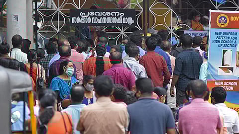 Parents of candidates sitting for the KEAM entrance examination at Cotton Hill GHSS in Thiruvananthapuram gathered near the school gate in violation of COVID-19 protocol on Thursday. (Photo | BP Deepu/EPS)