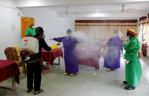 Sri Lankan municipal health workers are disinfected after a swab sample collecting session to test for COVID-19 in Colombo, Sri Lanka, Tuesday, July 14, 2020. (Photo | AP)