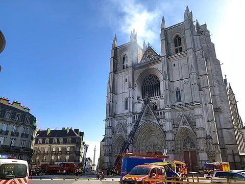 Fire fighters brigade work to extinguish the blaze at the Gothic St. Peter and St. Paul Cathedral, in Nantes, western France, Saturday, July 18, 2020. (Photo | AP)