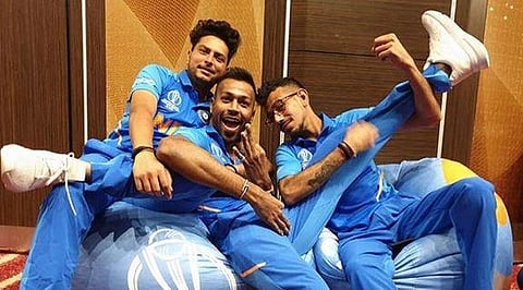 The right arm leg spinner in the picture can be seen holding Hardik's leg while sitting over a beanbag.