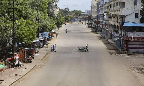 A road wears a deserted look duing complete lockdown imposed by the adminisration to curb the spread of coronavirus in Bhopal Sunday July 19 2020. (Photo | PTI)