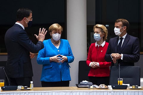 From left, Dutch Prime Minister Mark Rutte, German Chancellor Angela Merkel, European Commission President Ursula von der Leyen and French President Emmanuel Macron speak during a meeting on the sidelines of an EU summit in Brussels. (Photo | AP)