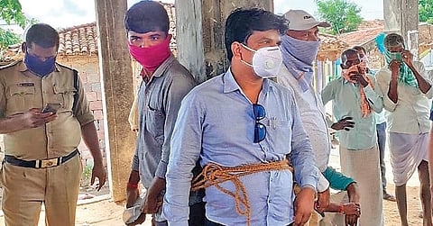 Electricity Department officials tied up with ropes at the panchayat office in Muslapur village of Alladurgam mandal, Sangareddy district, on Saturday