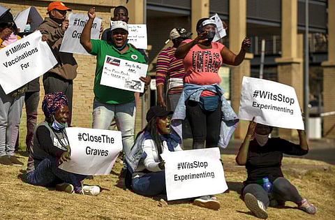 People protest against coronavirus trials in Africa, outside Chris Hani Baragwanath Hospita in the township of Soweto in Johannesburg, South Africa, Saturday, July 18, 2020. (Photo | AP)