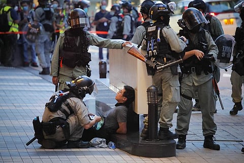 Police detained a protester during a march marking the anniversary of the Hong Kong handover from Britain to China, Wednesday, July. 1, 2020, in Hong Kong. (Photo | AP)