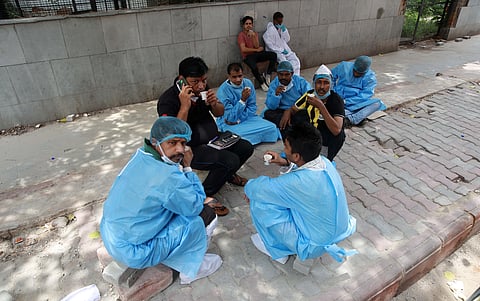 Health worker wearing PPE kit takes a break at LNJP Hospital in New Delhi. (Photo | Shekhar Yadav, EPS)