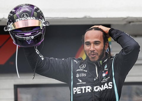 Mercedes' British driver Lewis Hamilton celebrates winning the Formula One Hungarian Grand Prix race at the Hungaroring circuit in Mogyorod near Budapest. (Photo | AFP)