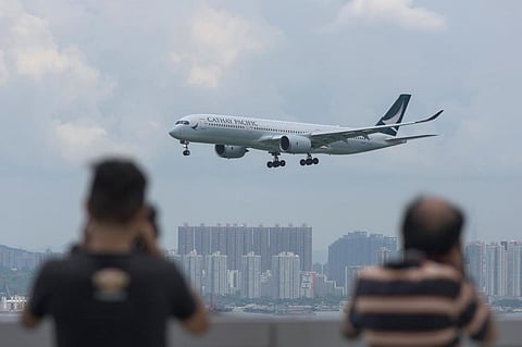 A Cathay Pacific passenger plane making its descent before landing at Hong Kong's international airport. 