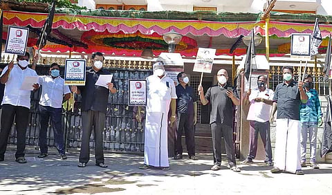 DMK treasurer Durai Murugan , along with party supporters protesting in front of his house at Gandhi Nagar. (Photo | Express)