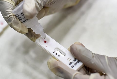 A health worker collects a sample of a Greater Chennai Corporation employee for COVID-19 Rapid Antigen test (Photo | PTI)