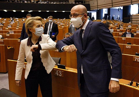 European Commission President Ursula von der Leyen, left, and European Council President Charles Michel bump elbows at the main chamber of the European Parliament in Brussels. (Photo | AP) |