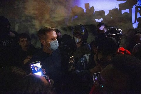 Portland Mayor Ted Wheeler wades through the large crowd, where his stated goal was to conduct a 'listening session,' Wednesday, June 22, 2020 in Portland. (Photo | AP)