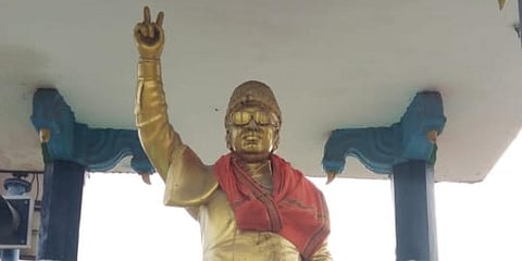 The statue of MG Ramachandran on the Puducherry Villupuram Highway at Villianur was found with a saffron shawl. (Photo | EPS)