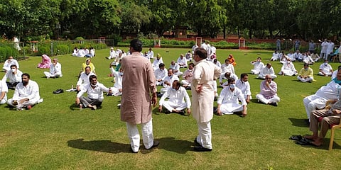 Congress MLAs in Rajasthan sit in a 'dharna' at Raj Bhavan lawns in Jaipur. (photo| Special Arrangement)