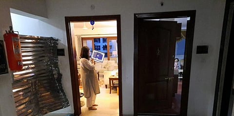 Hours after it sealed two flats in a Domlur apartment, BBMP was forced take off the tin sheets and block the corridor instead after the tweet  went viral | pic source: Twitter