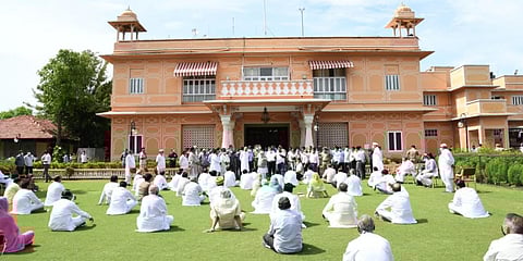 Congress MLAs in Rajasthan sit in a 'dharna' at Raj Bhavan lawns in Jaipur. (Photo| Special Arrangement)