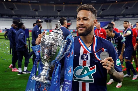 Paris Saint-Germain's Brazilian forward Neymar celebrates with the trophy after winning the French Cup final football match. (Photo | AFP)