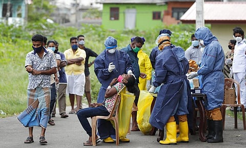 Sri Lankans wait for their turn to give their nasal swab samples to test for COVID-19 in Colombo, Sri Lanka, Wednesday, July 15, 2020. (Photo | AP)