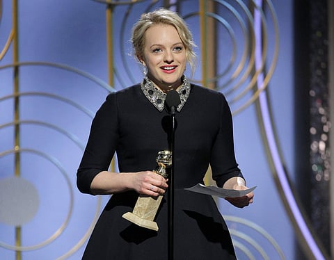 Elisabeth Moss has won the Golden Globe Award for best actress in a television drama.