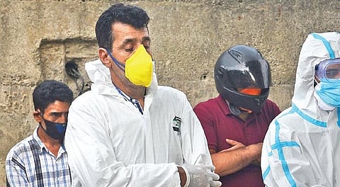 Ambuance driver Jameel Ahmad (in yellow mask) says his family stands by his work. (Photo| EPS)