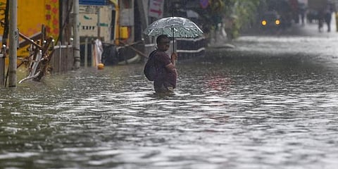 Floodwaters have entered homes in Bishunpur village of Darbhanga district, forcing people to wade through waist-deep water, even as they try and salvage their valuables. (Photo | PTI)