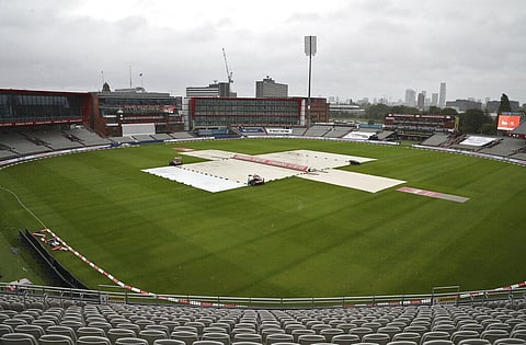 The pitch area is seen covered ahead of the fourth day of the third cricket Test match between England and West Indies at Old Trafford in Manchester, England, Monday, July 27, 2020. (Photo | AP)