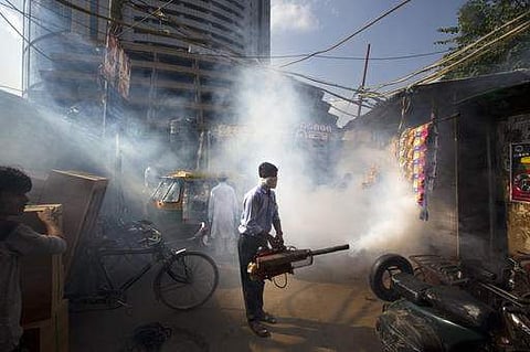 A municipal worker fumigates an area to check the spread of mosquito-borne diseases in New Delhi. (File photo| AP)