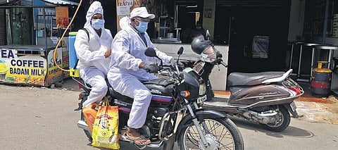 Sanitation workers leaving after spraying disinfectant at Arumbakkam in Chennai  on Tuesday | DEBADATTA MALLICK