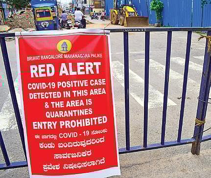 A poster announces sealing down of an area near JC Road in Bengaluru on Tuesday | Pandarinath b