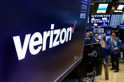 File photo shows the logo for Verizon above a trading post on the floor of the New York Stock Exchange. (Photo | AP)