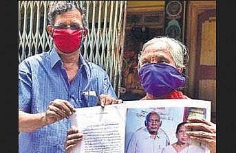 Vasantha Rao’s wife and friend show his pictures to the media in Vijayawada on Thursday | EXPRESS