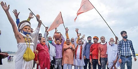 VHP members collect Ganga water and clay for the temple ceremony. (Photo | PTI)