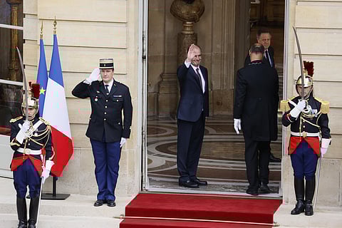 Newly named Prime Minister Jean Castex waves from the Prime minister residence after the handover ceremony in Paris. (Photo | AP)