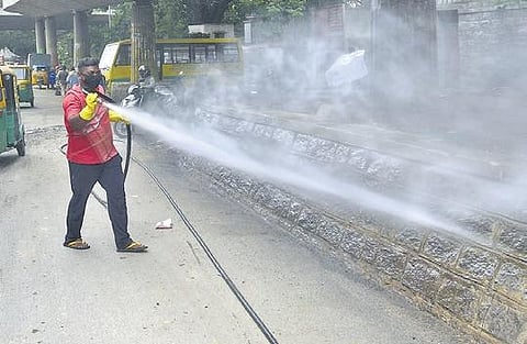 A BBMP worker sanitises Briand Square as Covid cases continue to rise in Bengaluru on Friday | VINOD KUMAR T