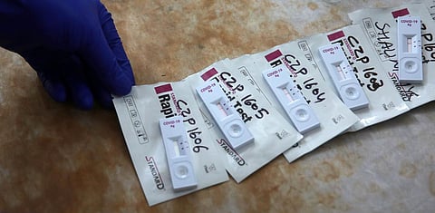 A medical lab technician collects swab samples for COVID-19 rapid antigen detection testing, in New Delhi. (Photo | Shekhar Yadav, EPS)