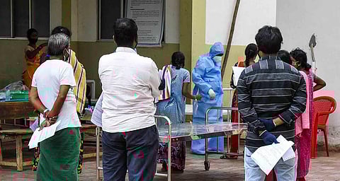 People waiting for Covid test at MGMGH Tiruchy. (Photo | M K Ashok Kumar, EPS)